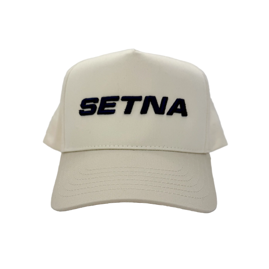 Beige cap with 'SETNA' text on a white background
