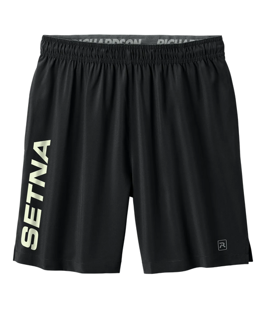 Black athletic shorts with a wide elastic waistband, featuring 'SETNA' printed vertically in light beige on the left leg and a small logo on the lower right hem, shown against a plain white background.