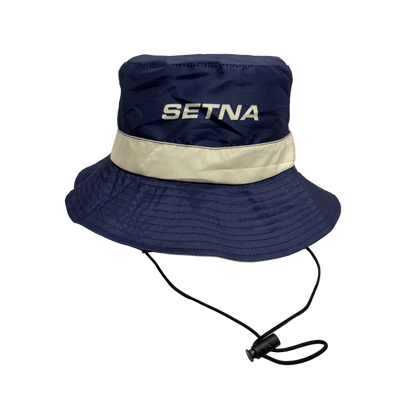 Navy bucket hat with beige band and 'SETNA' branding on a white background