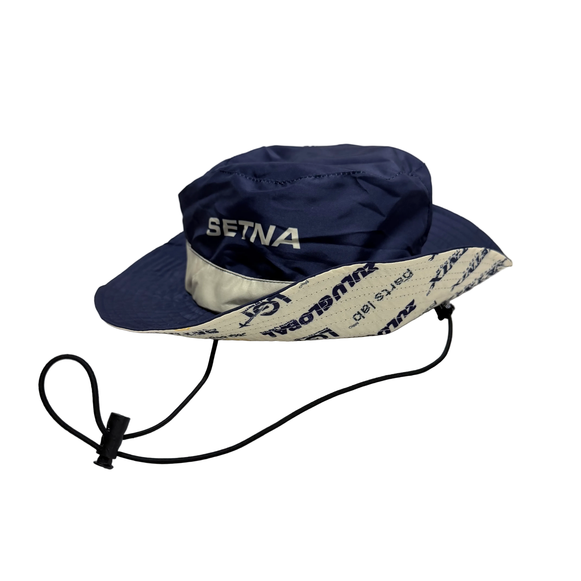 Navy blue sun hat with white brim and 'Setina' branding on a white background